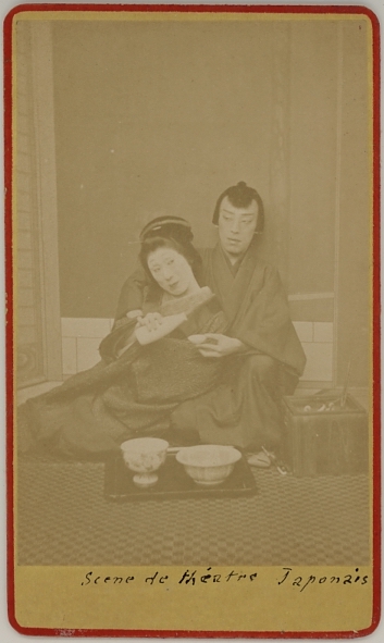Photograph of a Japanese actress and actor in a theatrical scene.  Ca. 1875-80