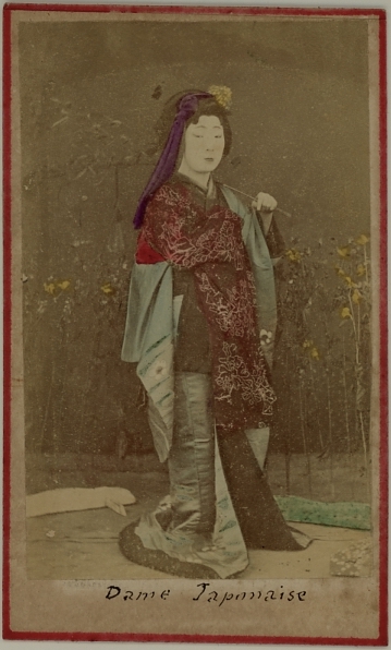 A handcolored photograph of a Japanese lady in traditional dress.  Ca. 1875-80