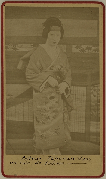 Japanese actor dressed as a female wearing a kimono.  Ca. 1875-80
