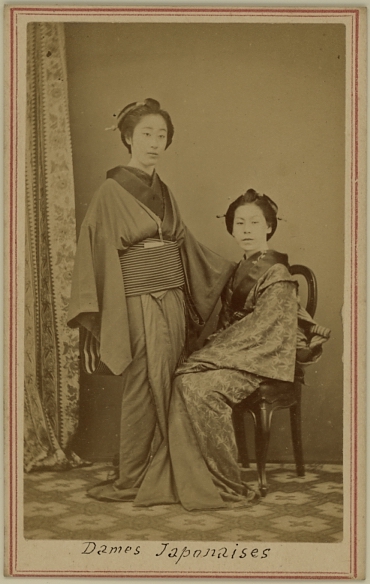 Two seated Japanese ladies in kimono.  Ca. 1875-80