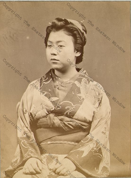 Portrait of a seated Geisha - albumen photograph by unknown photographer 1870's.