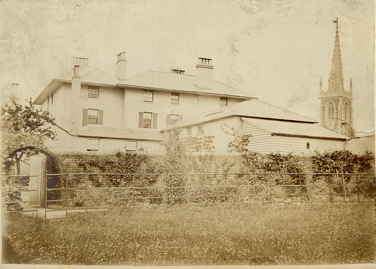 Unknown village church with house. Perhaps in the surroundings of Staplehurst. Photographed about 1875-80