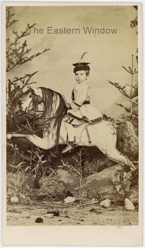 Archduke Rudolf of Austria (1858-1889) posing on his rocking horse