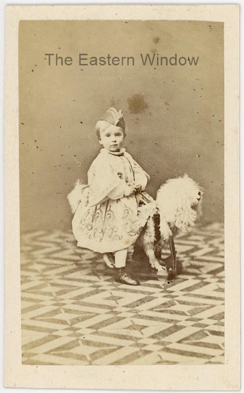Archduke Rudolf of Austria (1858-1889) posing on his rocking horse at young age